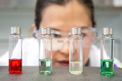 Scientist checking coloured samples